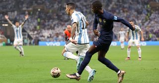 Ousmane Dembele of France fouls Angel Di Maria of Argentina to concede a penalty during the FIFA World Cup Qatar 2022 Final match between Argentina and France at Lusail Stadium on December 18, 2022 in Lusail City, Qatar.