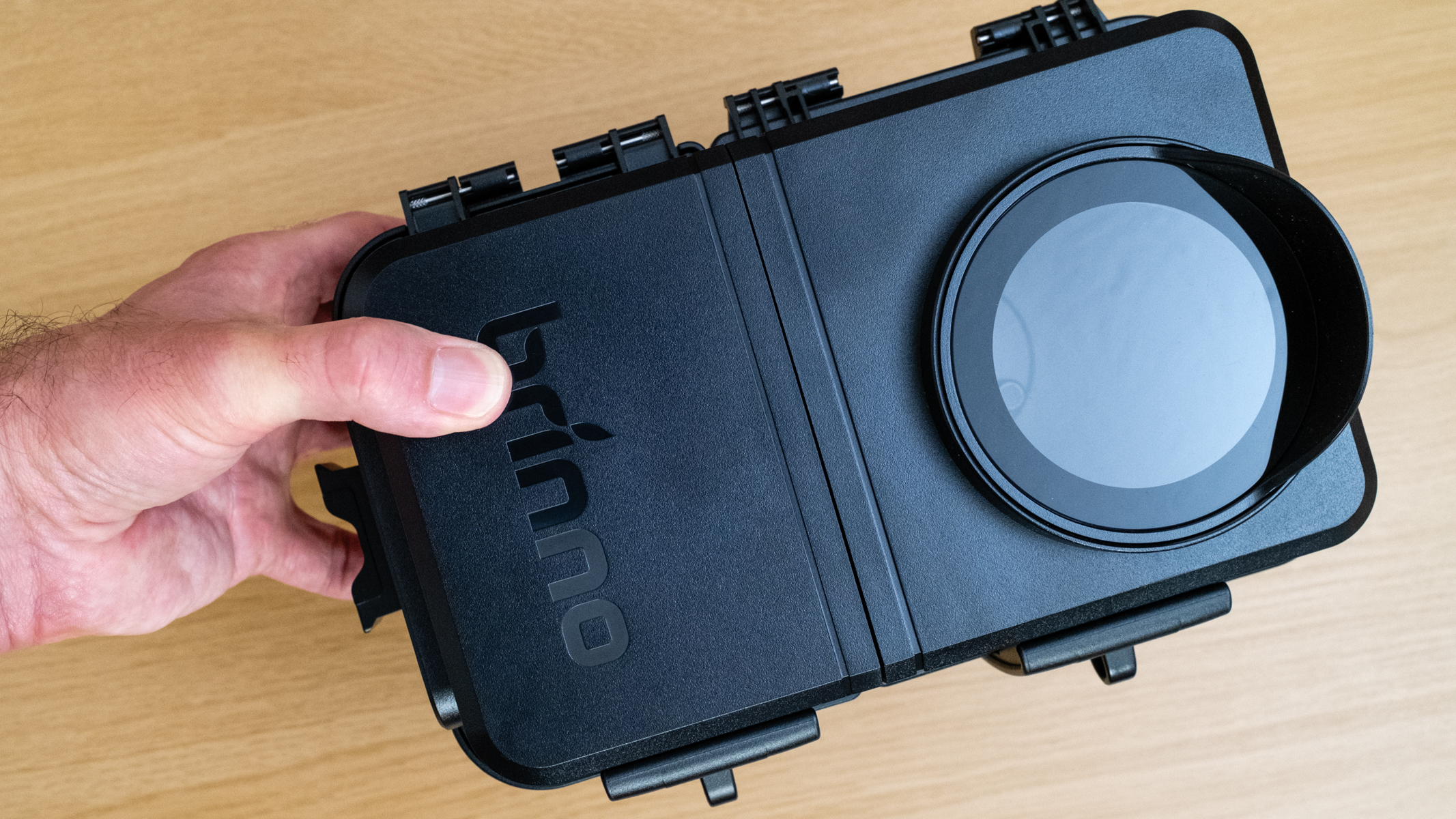 Brinno BCC5000 Time Lapse Bundle housing held in a hand for scale