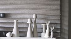 Small rabbit figurines on a mantelpiece