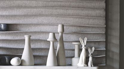 Small rabbit figurines on a mantelpiece 
