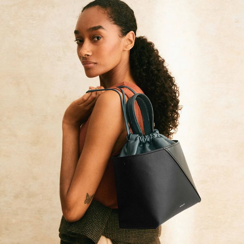 The Portobello Small Drawstring Cross Body carried by model 