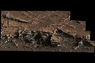 Mars looks pretty dry now, but mineral veins were deposited by fluids moving through rock.