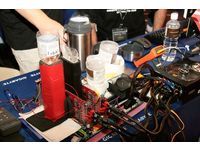 By utilizing ready-made materials, Team USA uses mineral water bottles to assist LN2 being poured into the copper cylinder of the processor and display card.