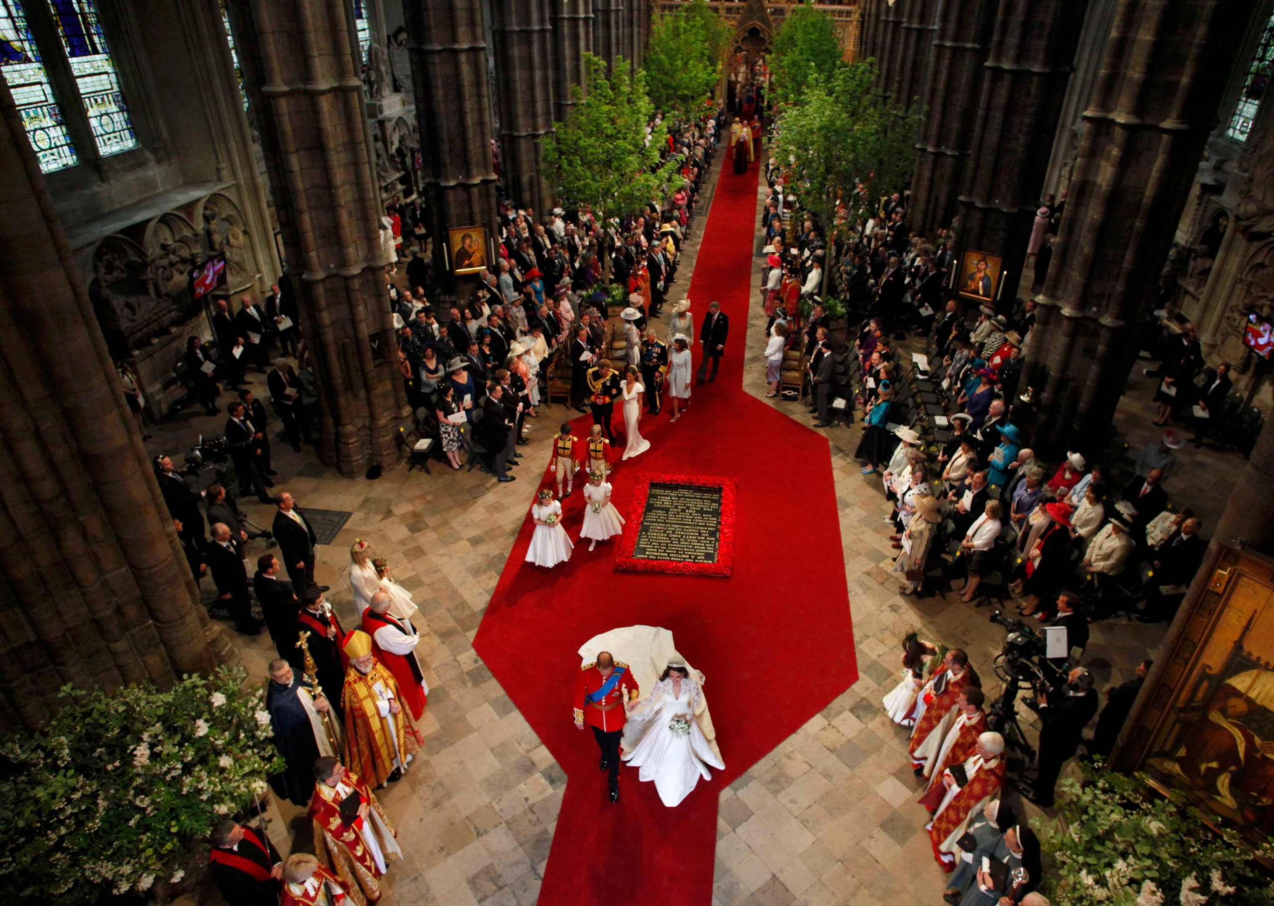 An aerial shot of Prince William and Princess Kate walking down the aisle at Westminster Abbey