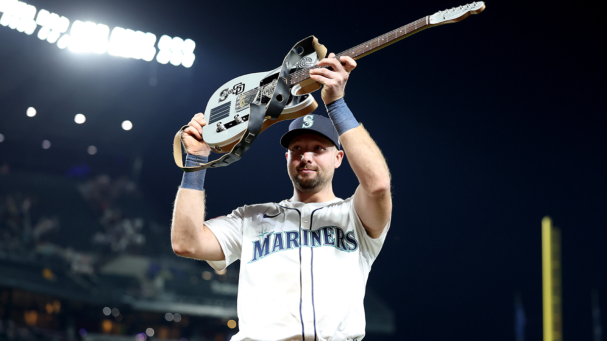 Cal Raleigh #29 of the Seattle Mariners lifts the &quot;Vedder Cup&quot; on August 25, 2025 in Seattle, Washington