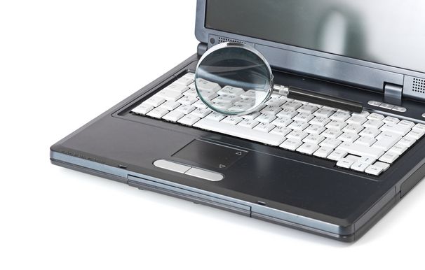 Laptop with a magnifying glass