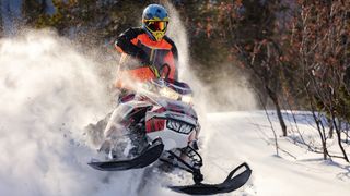 an image of a snowmobile in action