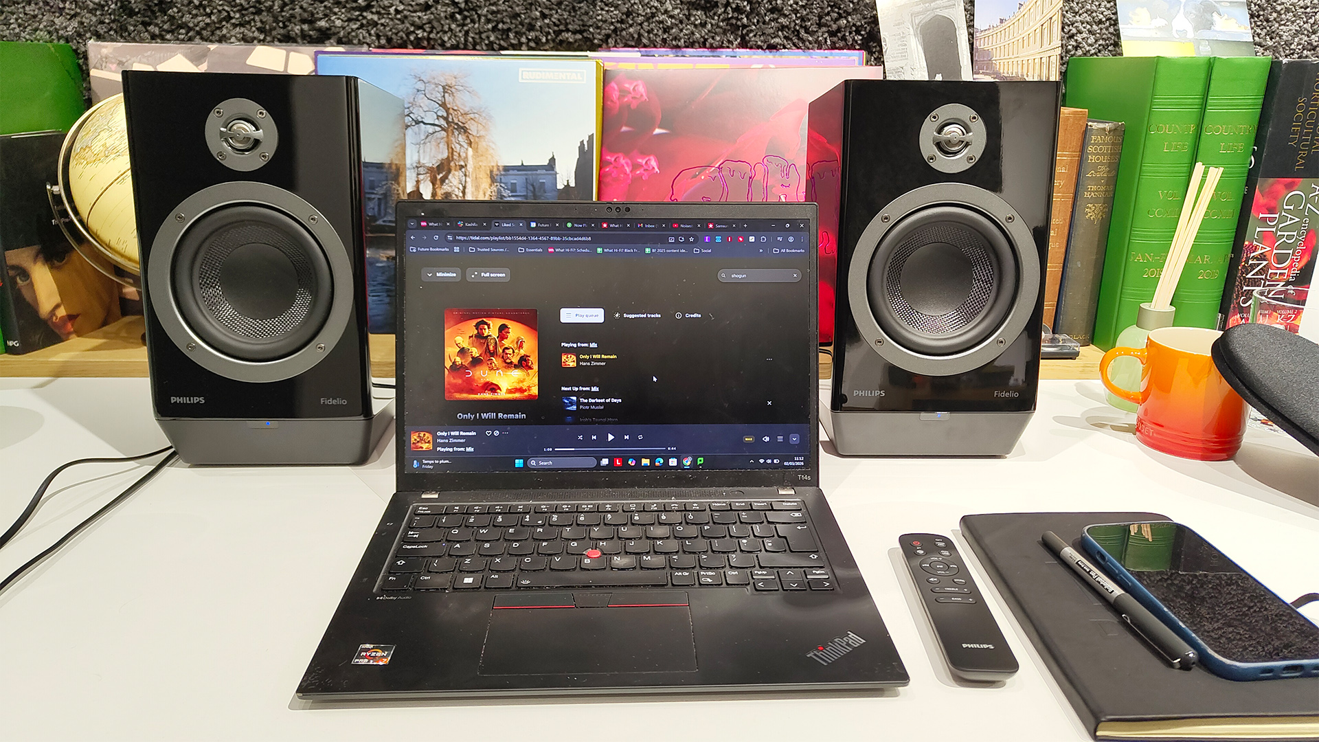 Philips Fidelio FA3 desktop speakers on white wooden desk either side of laptop