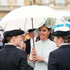Catherine, Duchess of Cambridge speaks to guests during a Royal Garden Party at Buckingham Palace on May 25, 2022 in London, England