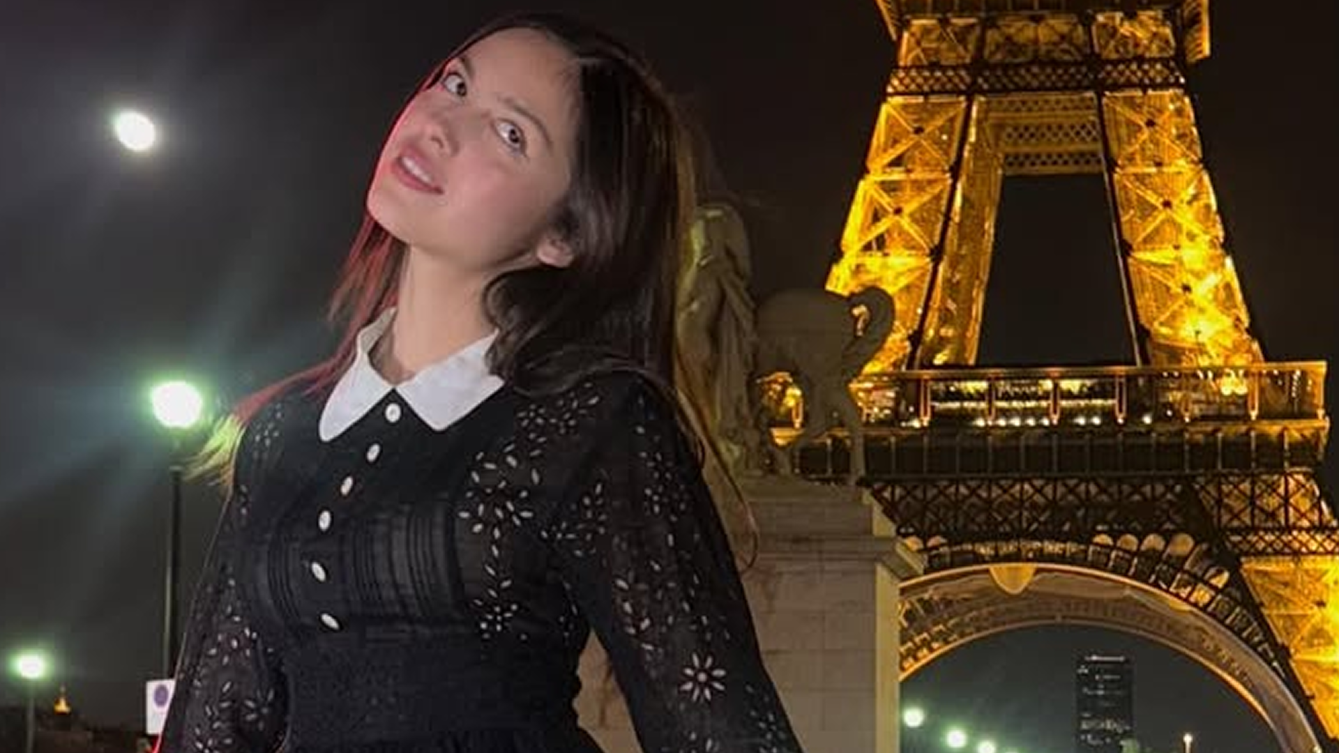 Olivia Rodrigo posed outside the Eiffel Tower in a vintage little black dress from Anna Sui Spring 1994