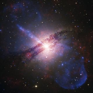 a bright purple galaxy in deep space