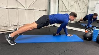 Personal trainer at Bio-Synergy Jay Conroy performs a static lunge with twist