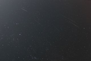 Geminid Meteors Composite Photo by Mike Hankey