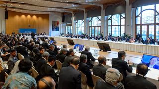General viewof the assembly taking part in the so-called Geneva II peace talks next to UN-Arab League envoy for Syria Lakhdar Brahimi (L) on January 22, 2014 in Montreux. Representatives of S