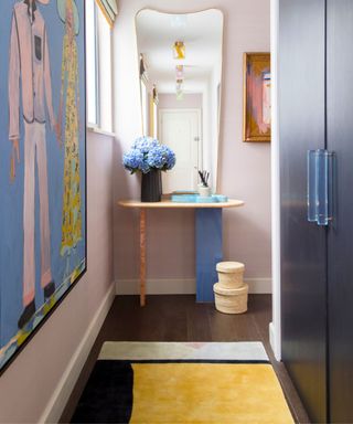 dressing room with pastel colors and pop of yellow rug