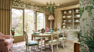 Chandelier with scalloped-edge shades in a dining room