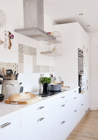white units with expensive fixtures in a scandinavian style kitchen diner