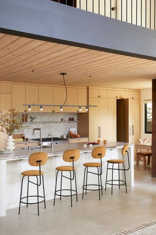 a kitchen with a terrazzo slab backsplash