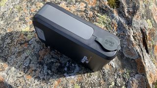 Vango powerbank on a rock showing 12V output