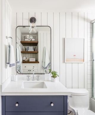 Bathroom design with white shiplap paneling by