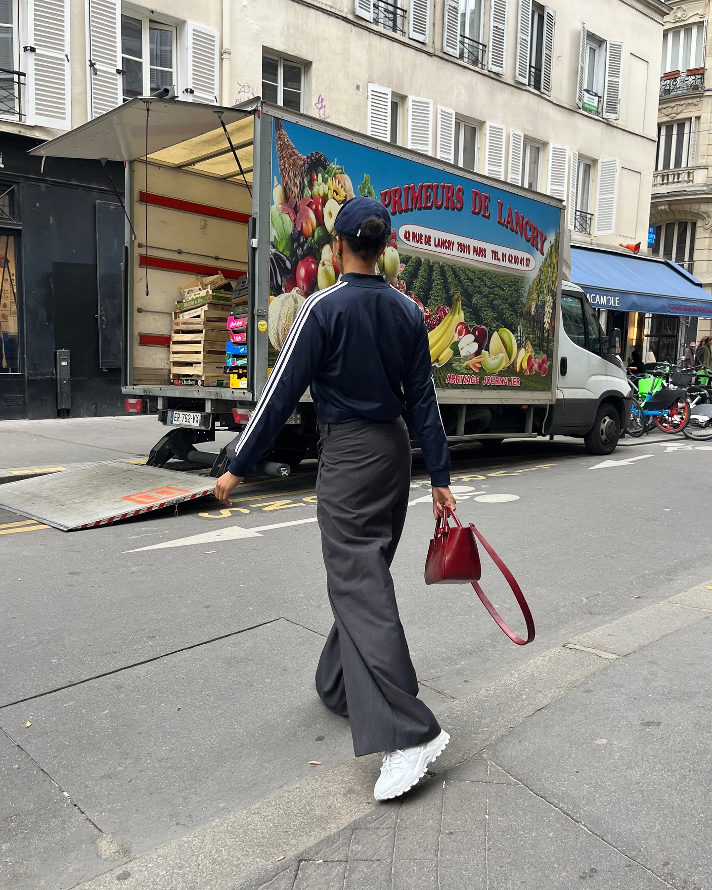 Woman wearing chunky sneakers in Paris