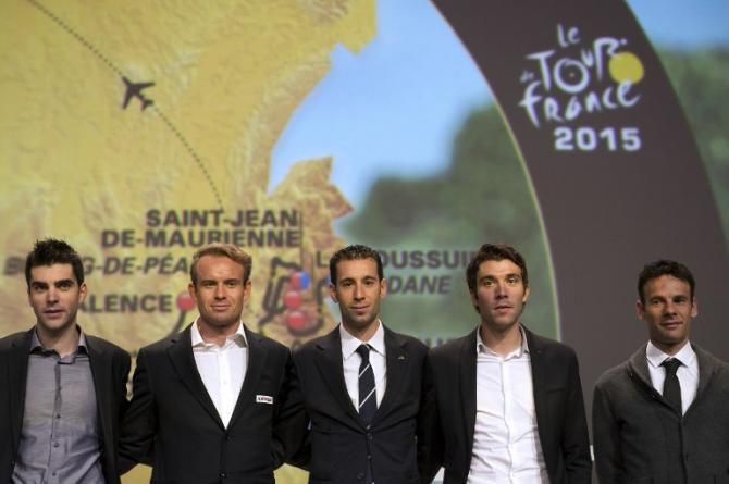 The riders pose under the map of the 2015 Tour de France