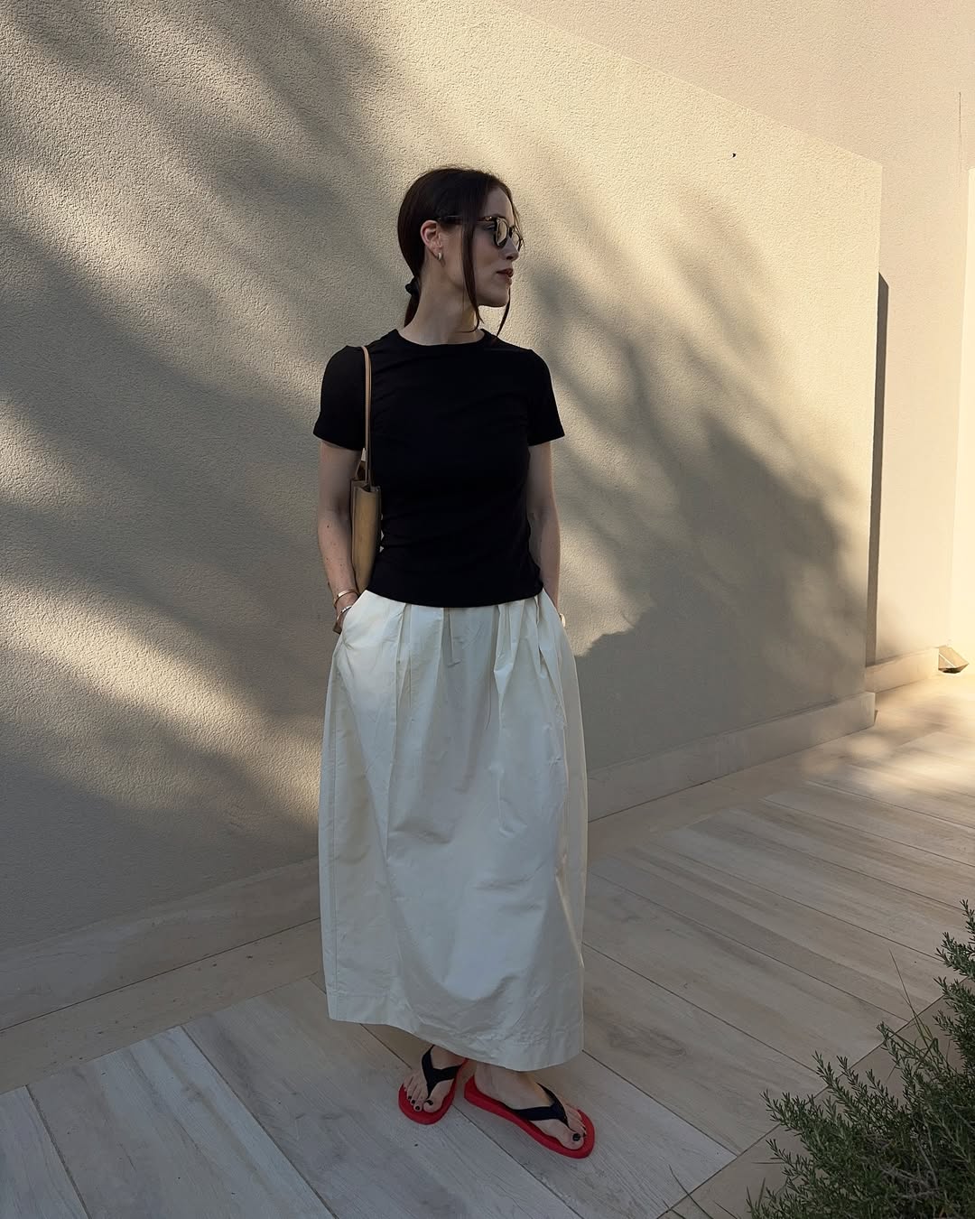@annabelrosendahl wears The Row flip-flops