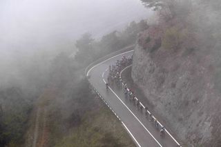 THYON 2000 LES COLLONS SWITZERLAND MAY 01 The Peloton passing through foggy landscape at climb of Suen 1430m during the 74th Tour De Romandie 2021 Stage 4 a 1613km stage from Sion to Thyon 2000 Les Collons 2076m Landscape Vineyards TDR2021 TDRnonstop UCIworldtour on May 01 2021 in Thyon 2000 Les Collons Switzerland Photo by Luc ClaessenGetty Images