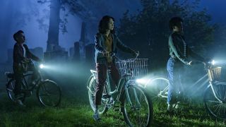 Lilly, Rich and Ronnie biking through cemetery in the dark in IT: Welcome to Derry Ep 3