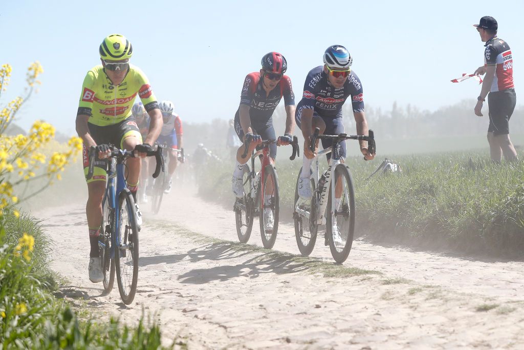 ROUBAIX FRANCE APRIL 17 LR Michal Kwiatkowski of Poland and Team INEOS Grenadiers and Gianni Vermeersch of Belgium and Team AlpecinFenix compete passing through a cobblestones sector during the 119th ParisRoubaix 2022 Mens Elite a 2572km one day race from Compigne to Roubaix ParisRoubaix WorldTour on April 17 2022 in Roubaix France Photo by Bas CzerwinskiGetty Images