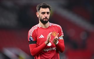 Bruno Fernandes applauds the Manchester United fans after defeat to Brighton in the Premier League at Old Trafford in January 2025.