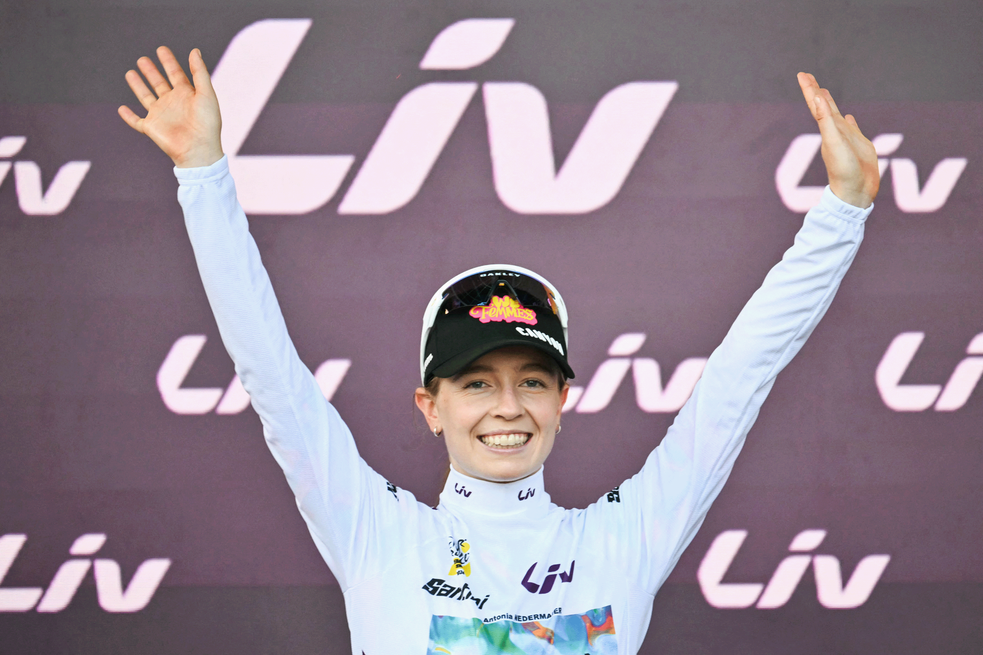 Canyon-SRAM rider Antonia Niedermaier celebrates on the podium with the best young rider's white jersey after the Tour de France Femmes 2026