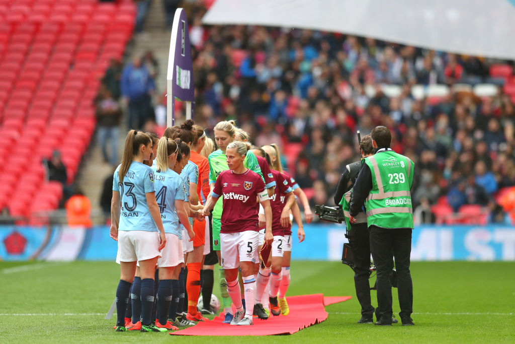 Gilly Flaherty of West Ham United Ladies leads her team as they shake hands with the Manchester City Women's team prior to the Women's FA Cup Final match between Manchester City Women and West Ham United Ladies at Wembley Stadium on May 04, 2019 in London, England.