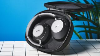 a pair of black headphones by earfun with cushiony ear cups and a black headband