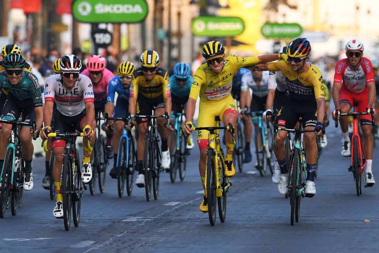 Tadej Pogačar gets congratulated by Primož Roglič after winning the Tour de France 2020