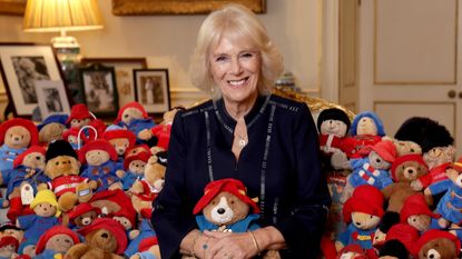 The Queen Consort posed with Paddington bears set to be donated 