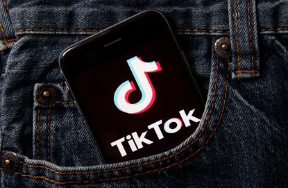 In this photo illustration the logo of Chinese media app for creating and sharing short videos TikTok, also known as Douyin is displayed on the screen of a smartphone on September 18, 2020 in Paris, France