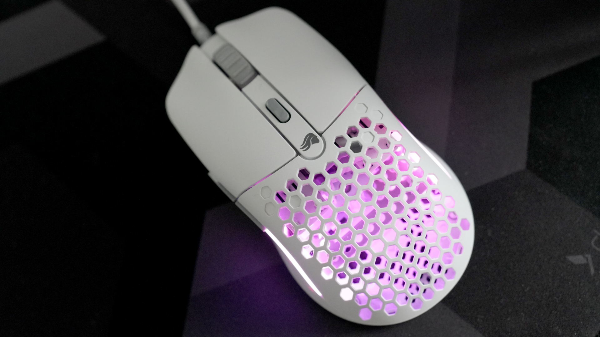 A Glorious Model O Eternal gaming mouse on a mouse mat with the lighting enabled.