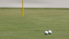 Two golf balls collide