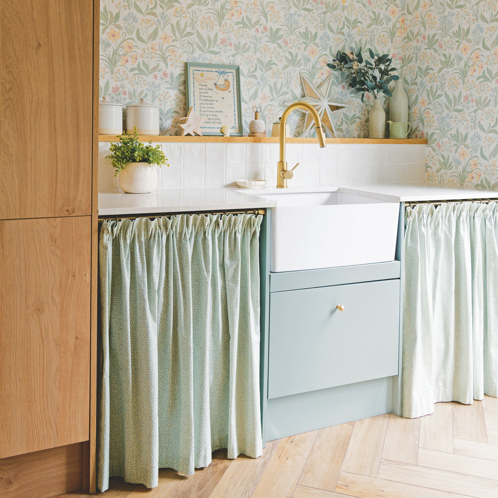 Utility room with a sink and cupboard curtains below it
