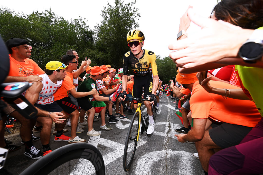 Jonas Vingegaard riding through Basque crowds at the 2023 Tour de France