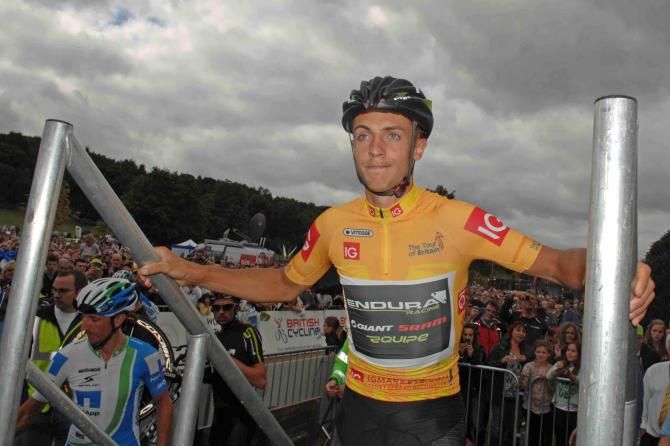 Race leader Jonathan Tiernan-Locke goes to sign on as race winner but lost the race after a positive doping test in 2014