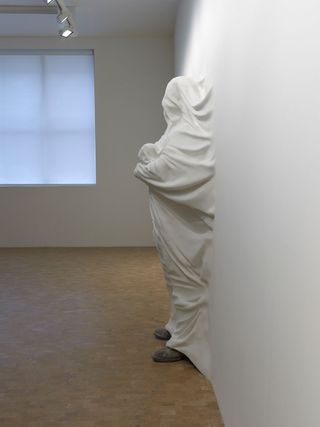 Shrouded in the gallery's white wall