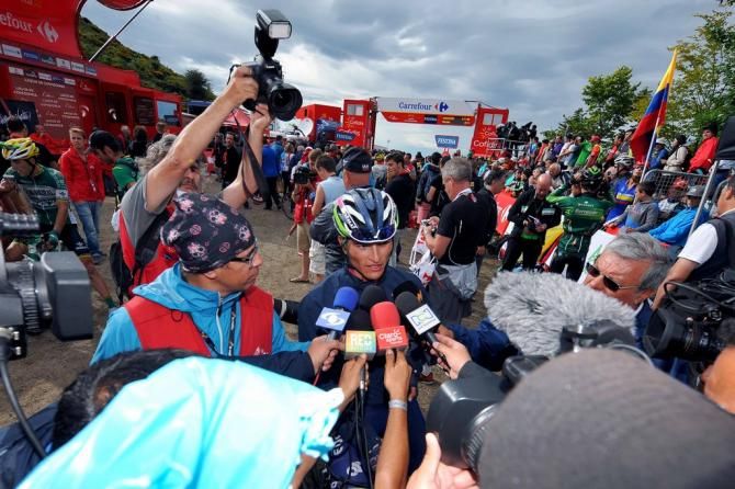 Winner Anacona (Lampre-Merida) swamped by the press