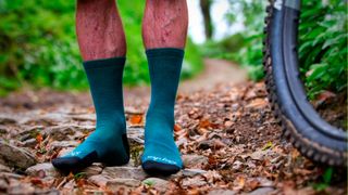 Rapha Trail socks being worn on a rocky trail