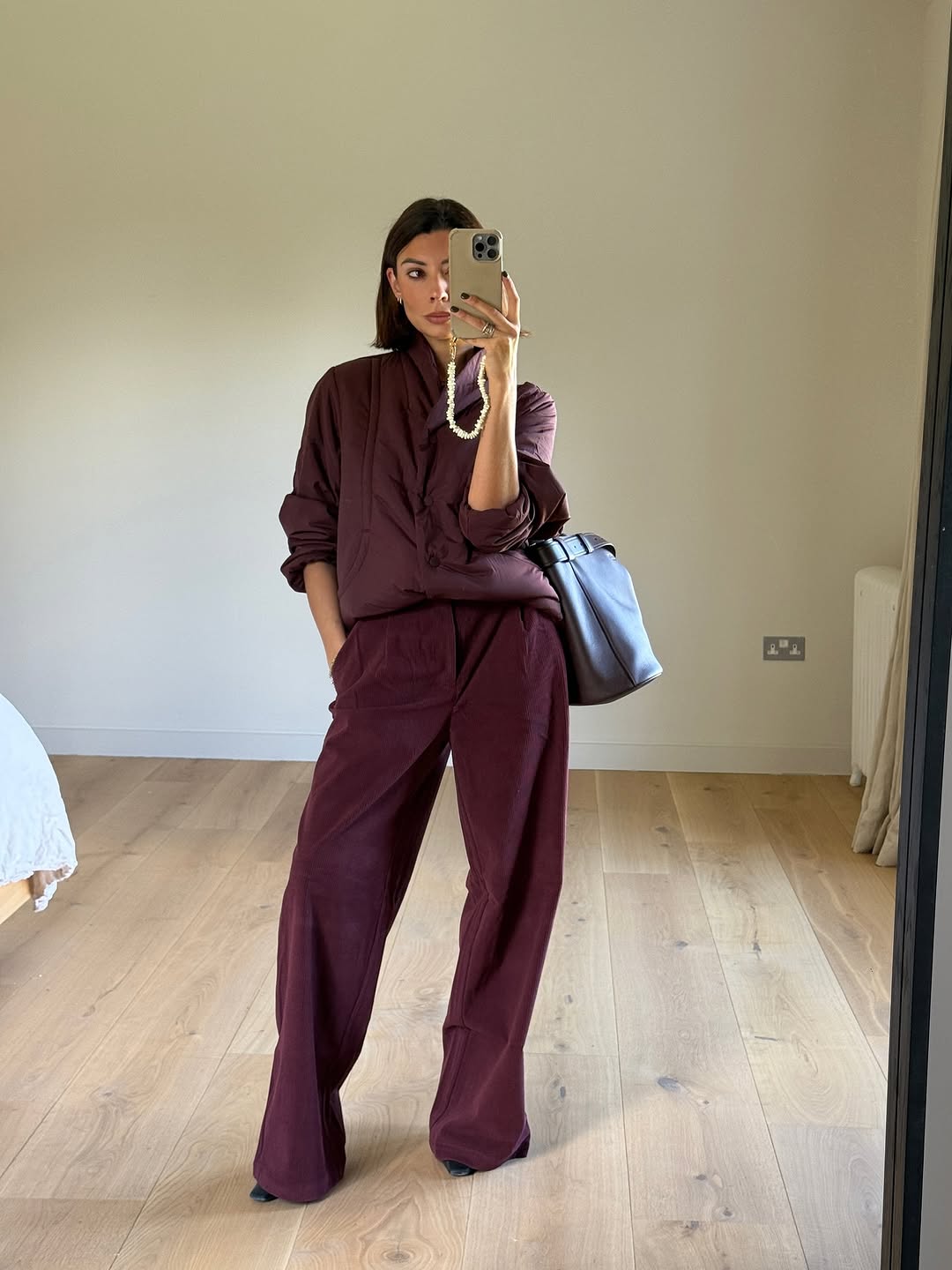woman wearing brown maroon color trend fall 2025
