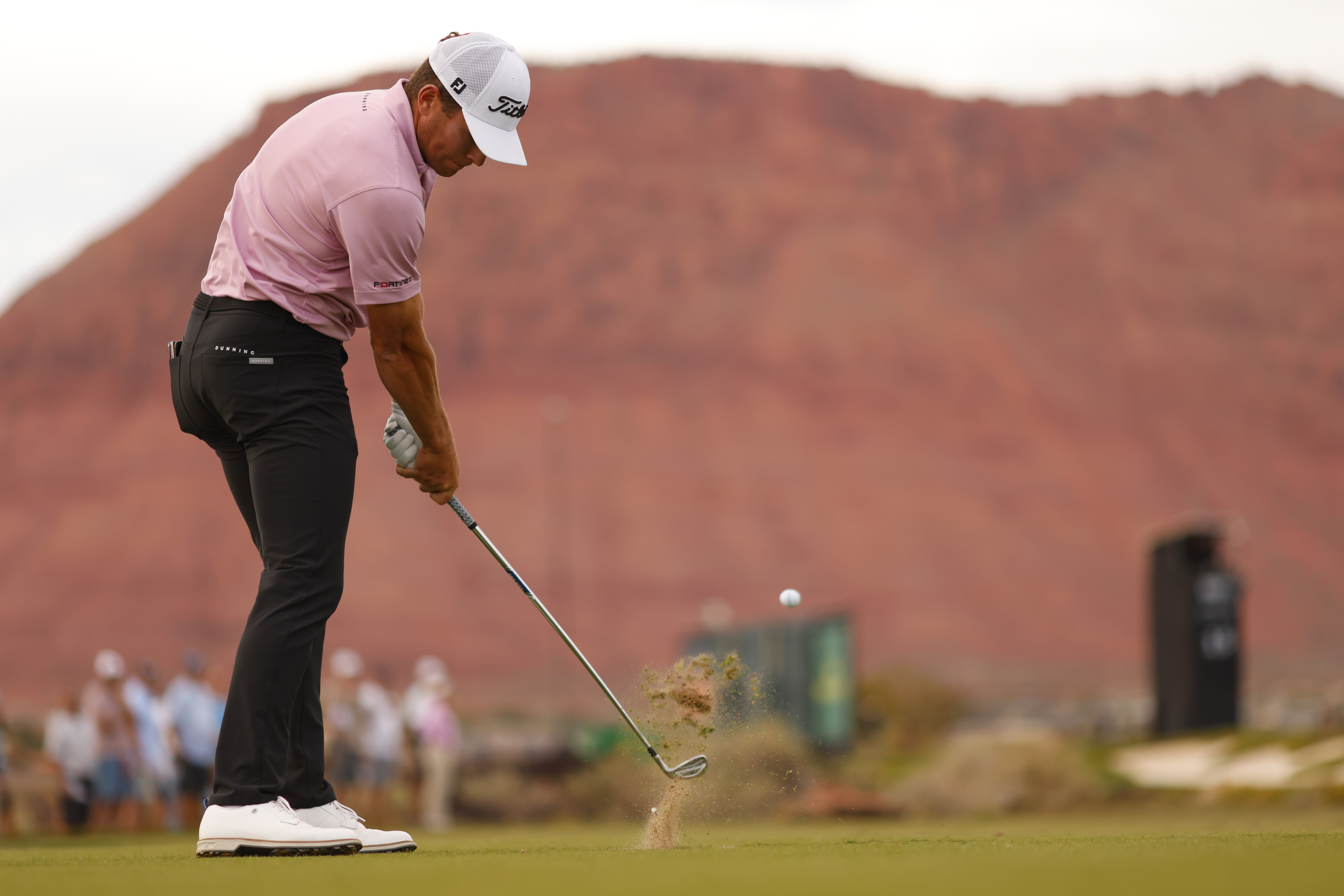 Michael Brennan hits an iron shot