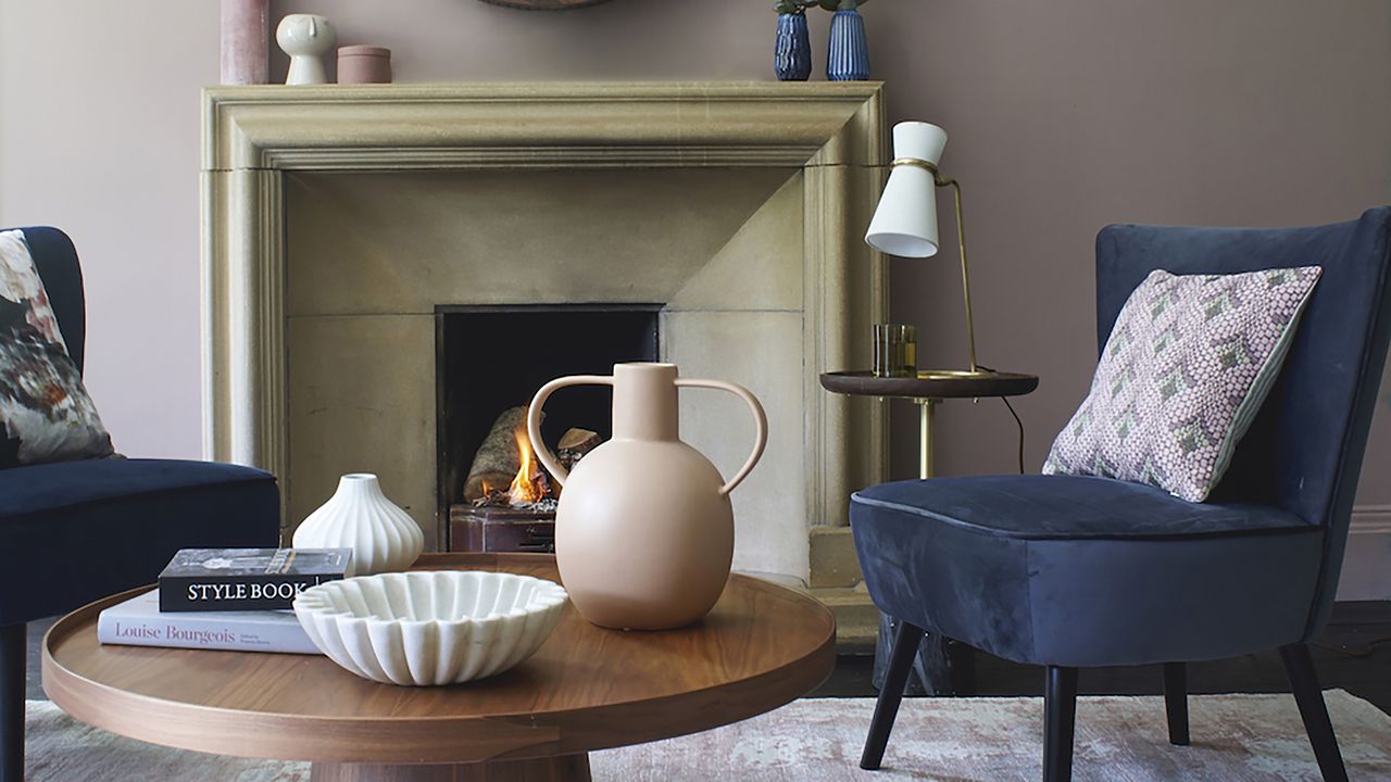 Living room with styled cofee table and two armchairs around it.