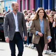 TOBERMORY, SCOTLAND - APRIL 29: Prince William, Prince of Wales, known as the Duke of Rothesay when in Scotland and Catherine, Princess of Wales, known as the Duchess of Rothesay when in Scotland arrive for a visit to a local market on April 29, 2025 in Tobermory, Scotland. The Prince and Princess of Wales are on a two-day visit to the Isles of Mull and Iona on the 29th and 30th of April to engage with rural island communities. During their time on the islands, they will connect with local residents, highlighting the value of social bonds and underscoring the importance of safeguarding and advocating for the natural environment. (Photo by Samir Hussein/WireImage)