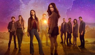 Roswell, New Mexico cast lined up in the desert